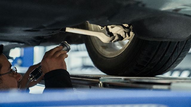Mechanic checking wheel